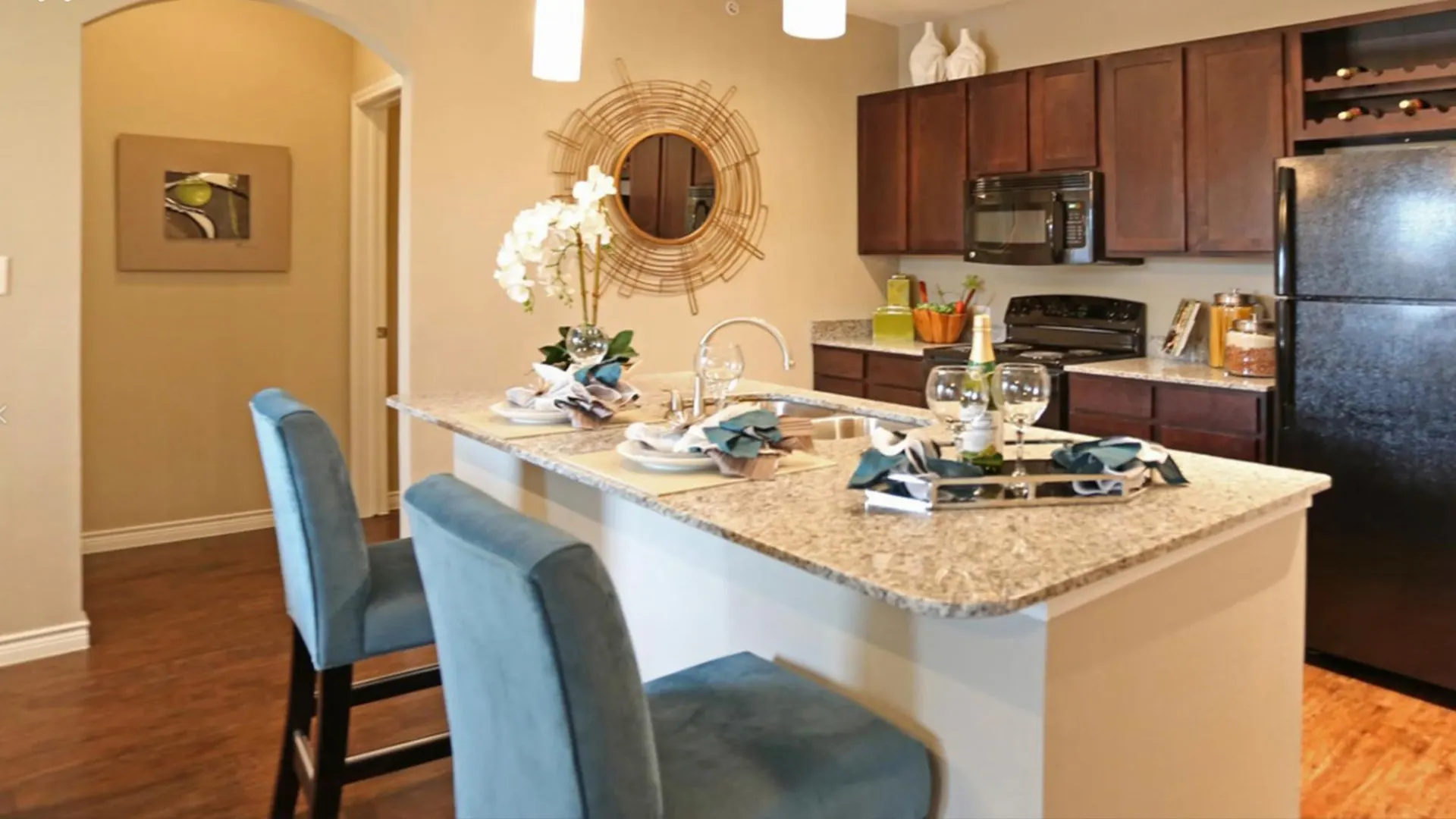 kitchen with granite counter tops and stainless steel appliances at The Latigo at Eagle Pass